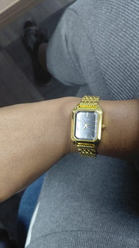 Reviewer's gold watch on their wrist, showing the perfect fit achieved with the adjusting tool.