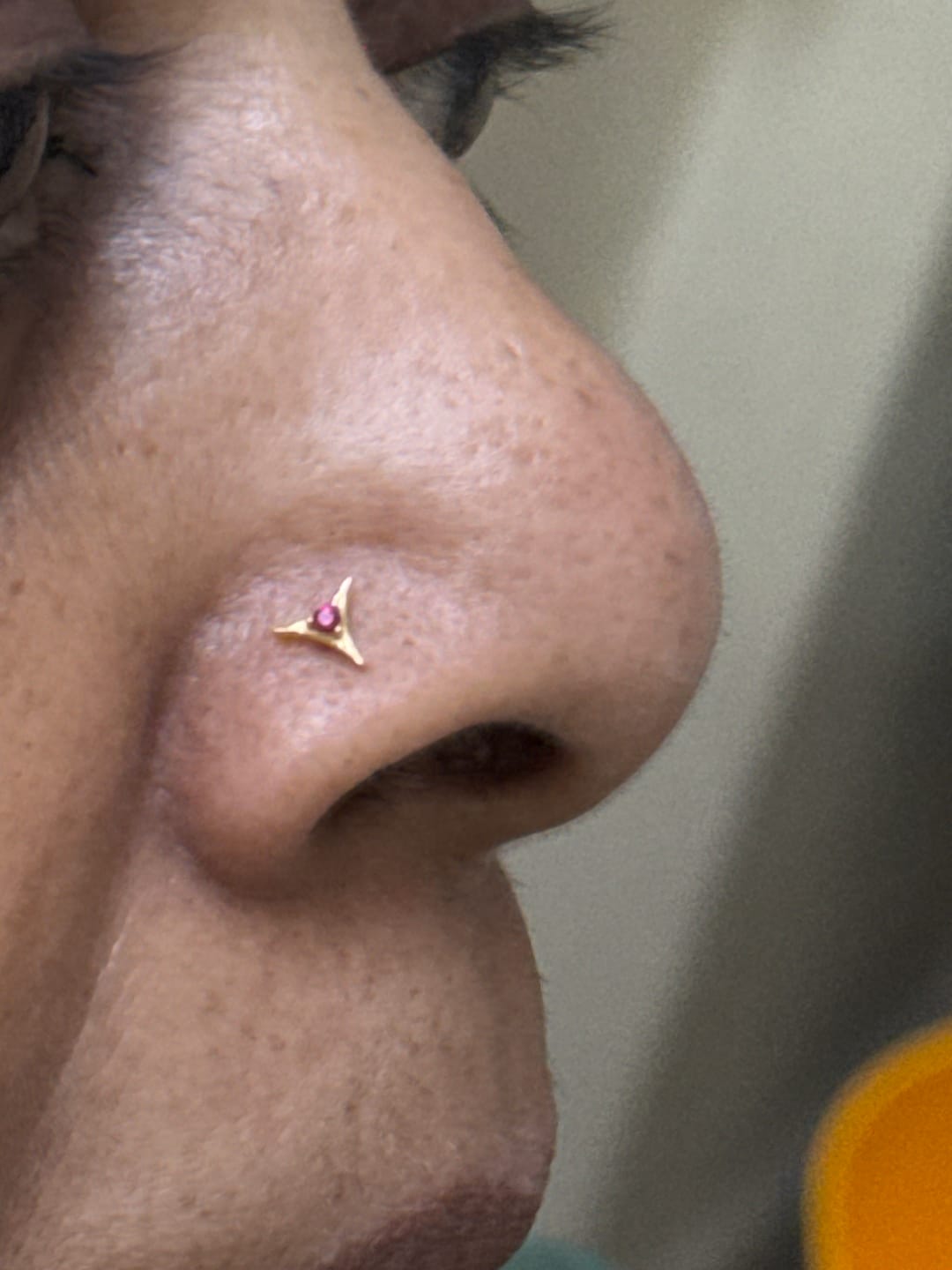 Customer photo review of Elegant Curve Triangle Screw Nose Pin