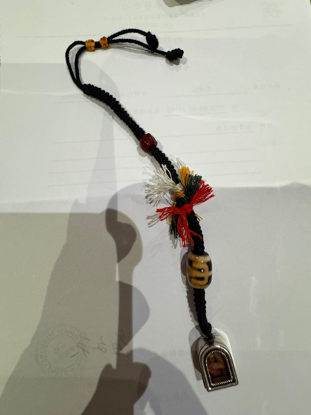 Customer photo review of Three-Eyed Dzi Tibetan Silver Braided Keychain Charm
