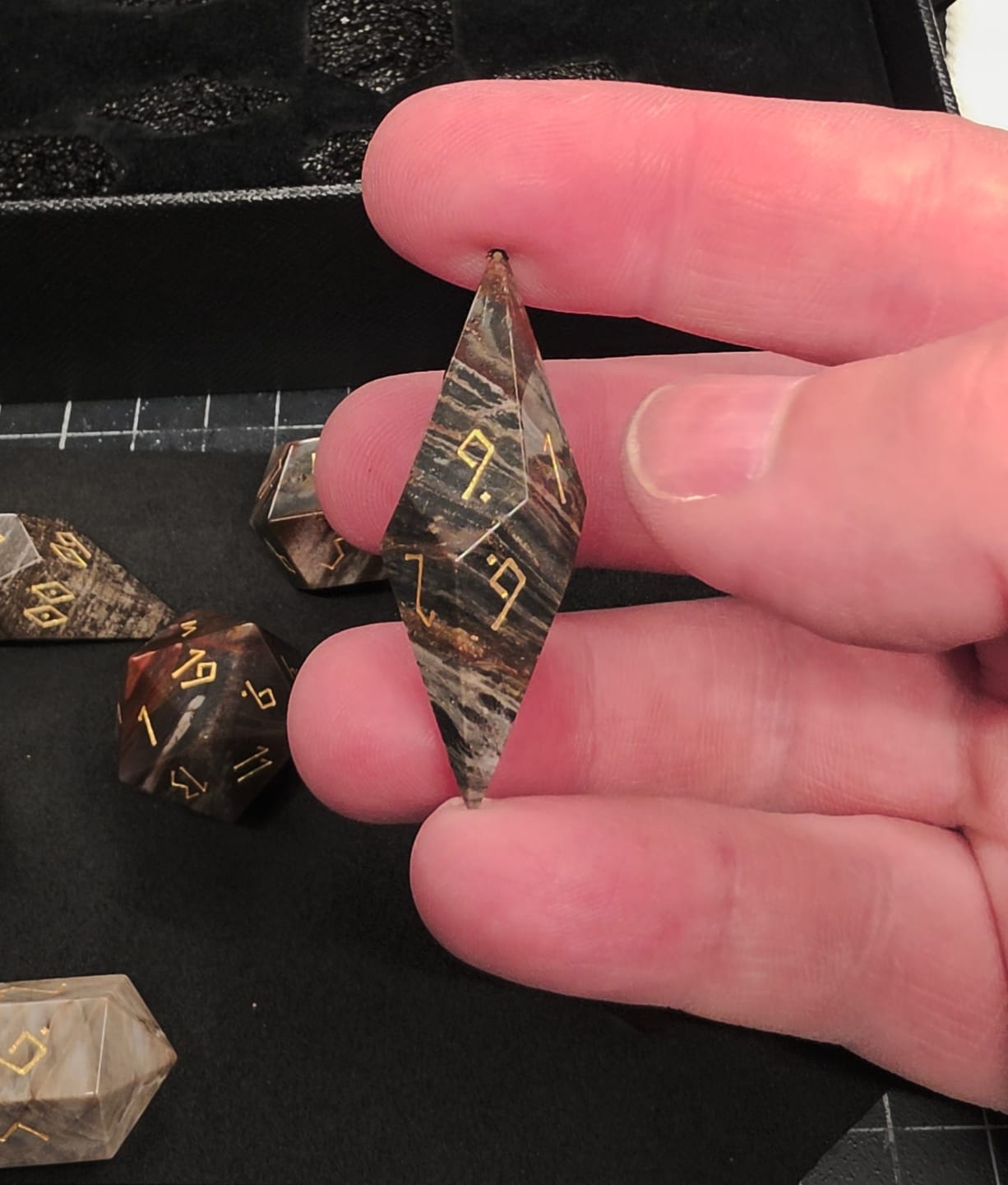 Customer photo review of URWizards D&D Petrified Wood Stone Dice Set Crystal Shape