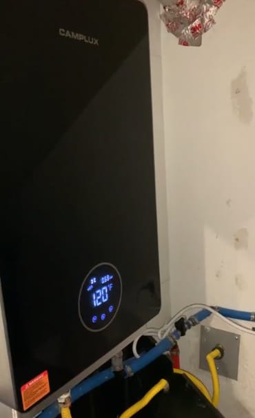 Customer photo review of 3.18 GPM Indoor Tankless Water Heater Propane with Wall Thimble, Black