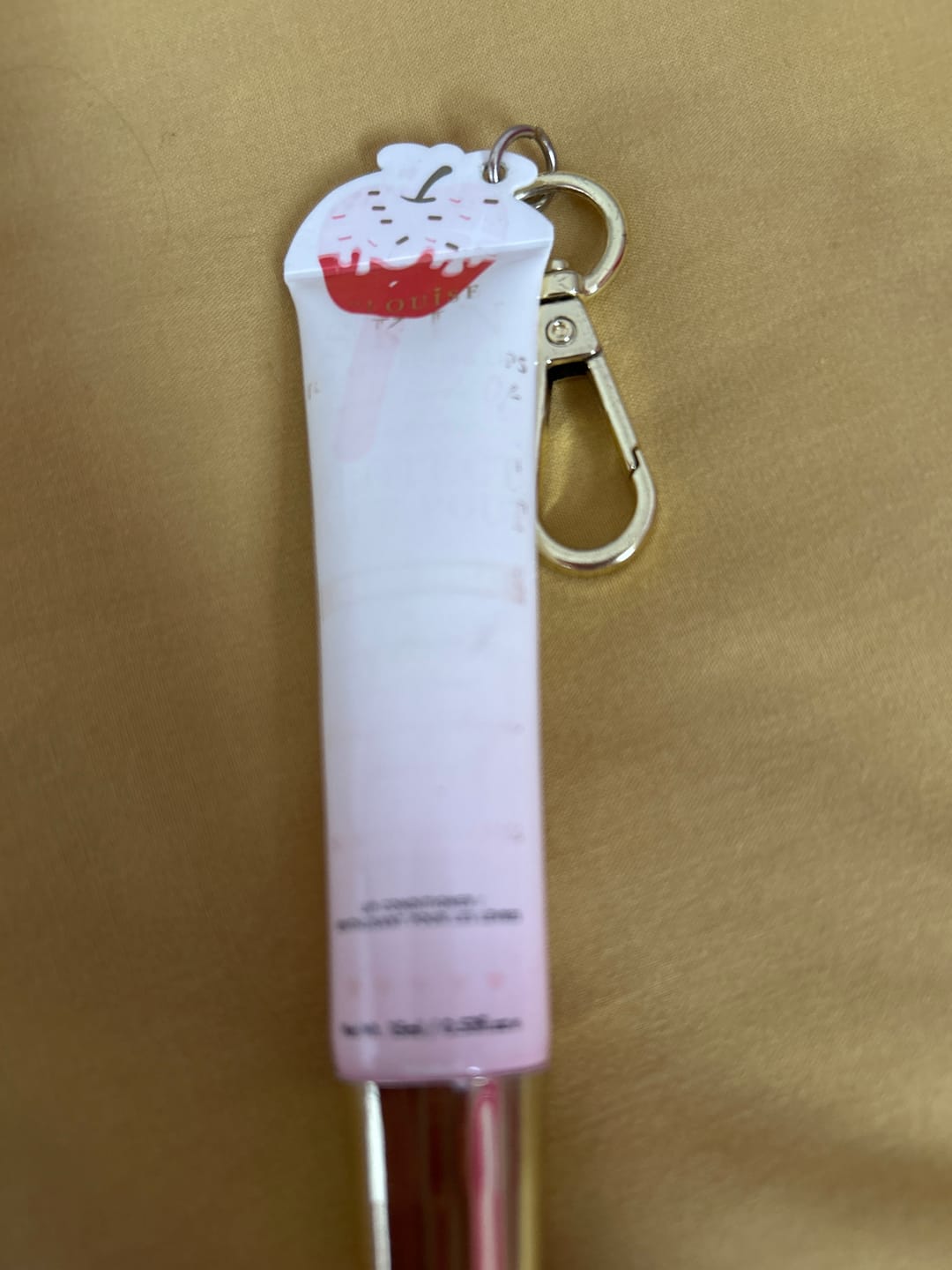 Customer photo review of Protect Your Pout Keychain Lip Conditioner