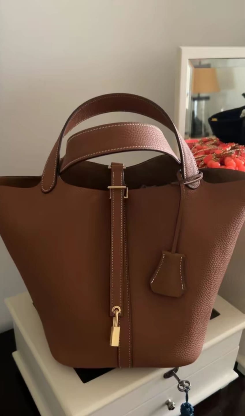Customer photo review of Kate – Pebbled Leather Lock Handbag