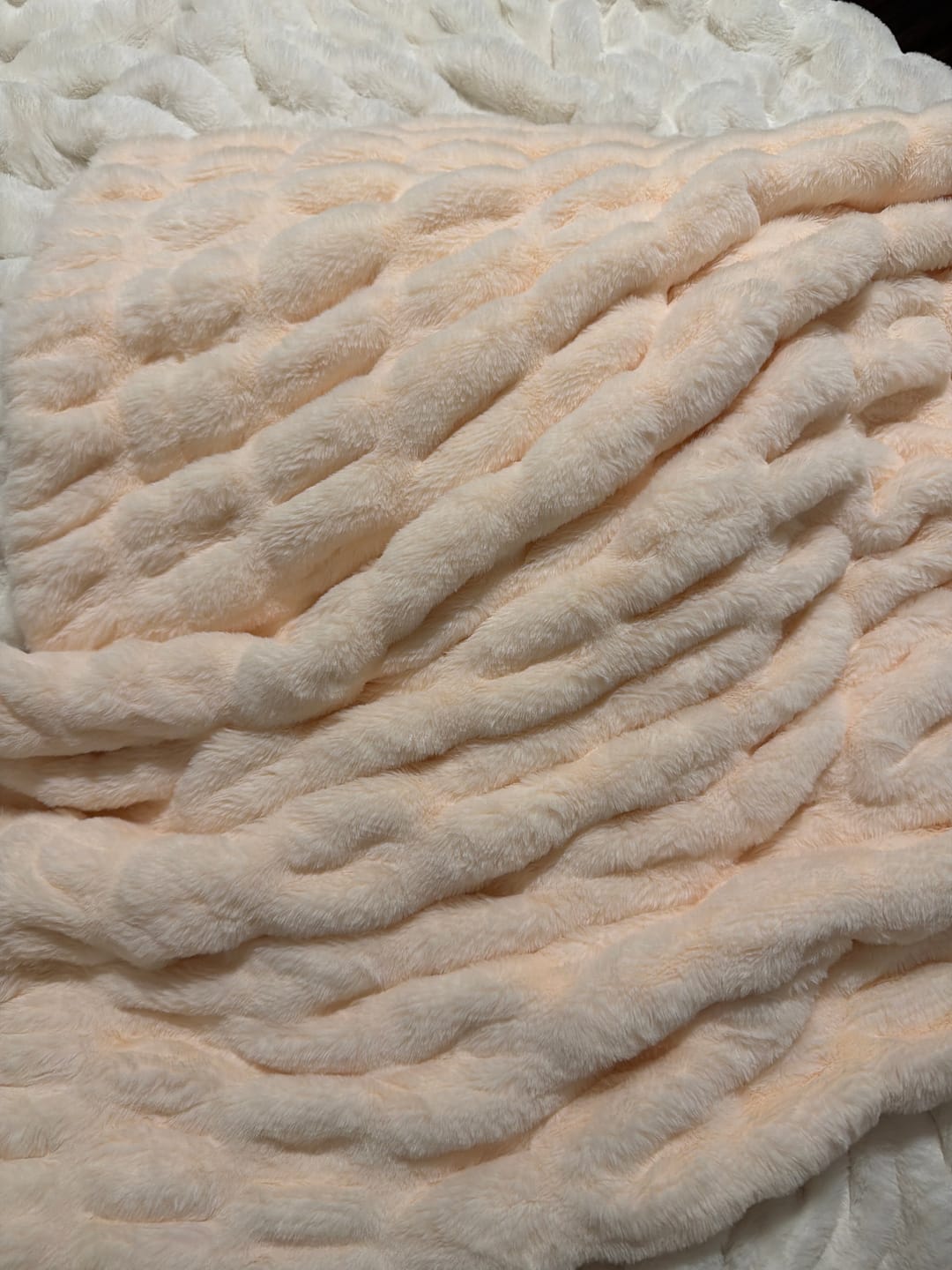 Customer photo review of Hugs Light Powder Puff Blanket