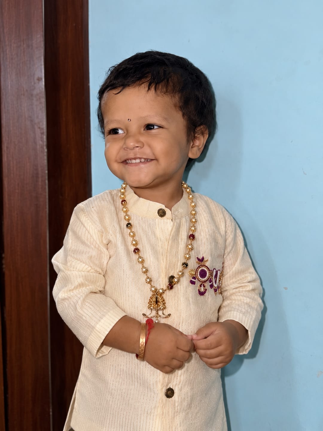 Customer photo review of White and gold tirupathi embroidred Kurta and Reshme Beige and Wine Dhoti for baby boy
