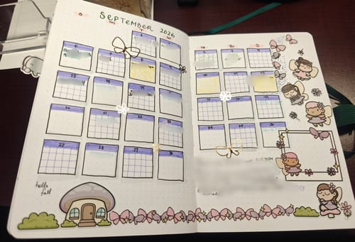 Reviewer's Sticker Subscription used in a journal, featuring fairy-themed stickers and a September calendar spread.