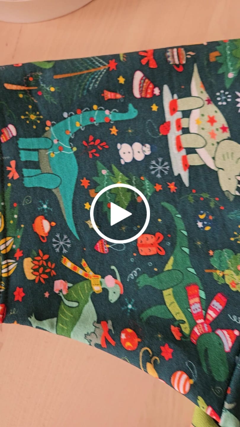 Customer video review of Christmas Dinosaurs on Dark Teal French Terry Fabric