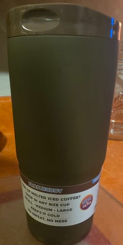 Customer's matte dark brown To-Go Buddy tumbler standing on a surface with the product packaging label visible.