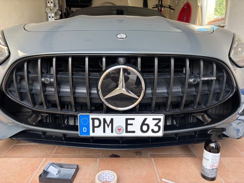 Customer's Mercedes AMG GT63 Coupe showing the installed OEM Plinth Delete Kit on the front grille.