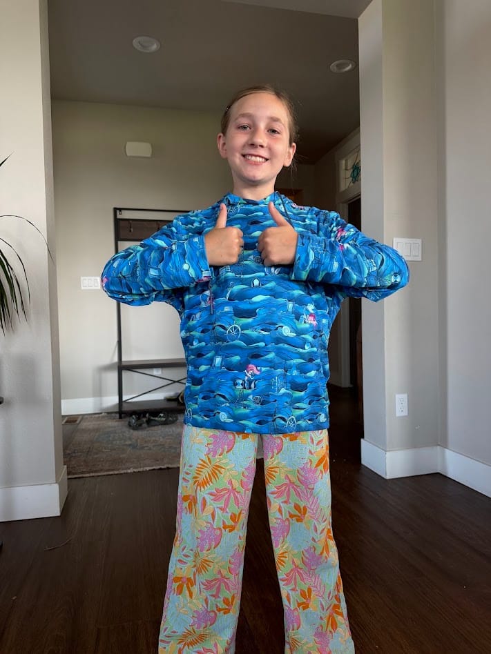 Customer photo review of Disney’s The Little Mermaid “The Secret Grotto" – Youth Performance Hoodie